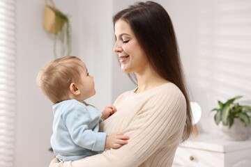 Mother with her cute little baby at home