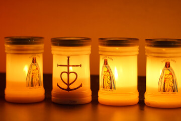 statue of saint sarah with tea lights and candles