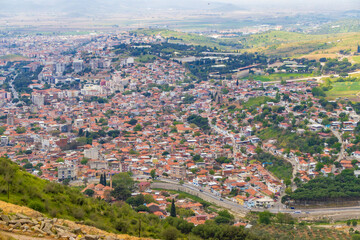 Wide angle shot of Bergama(pergamon) city center with iconic houses and Red Hall Basilica.