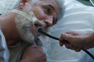 Gastroscopy procedure on sedated patient to examine upper digestive tract.