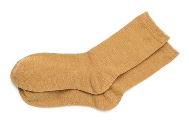 Pair of dark yellow socks isolated on white, top view
