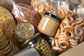 Different food products in box as background, closeup
