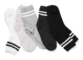 Many different pairs of socks isolated on white, top view