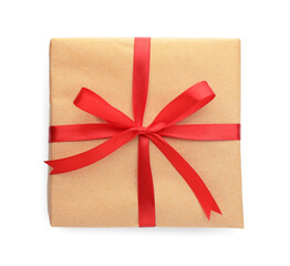 Gift wrapped in kraft paper with bow isolated on white, top view