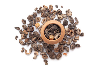 A mud pot filled with organic dried Gooseberry (Phyllanthus emblica) or Amla is placed on a heap of...