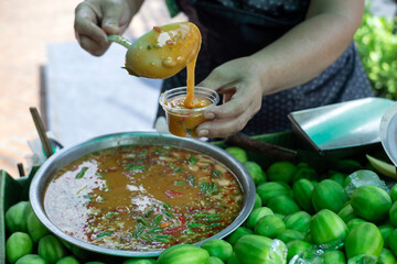 Vendor Selling fresh fruit. Street food of Thailand.