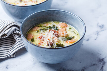 Zuppa toscana soup with sausage, bacon and potatoes.