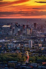 Elevated sunset view of the London skyline with Canada Water, Elephant and Castle and Chelsea district in the background