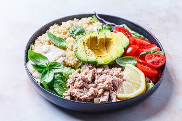 Tuna and quinoa salad with avocado and tomato.