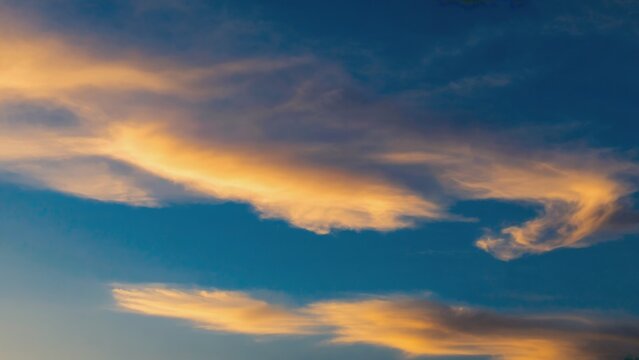 Sky at sunset with vibrant clouds and warm colors.