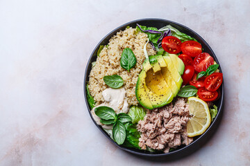 Tuna and quinoa salad with avocado and tomato.