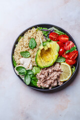 Tuna and quinoa salad with avocado and tomato.