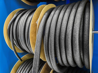 High-quality foam insulation rolls displayed for construction and industrial applications at a warehouse setting