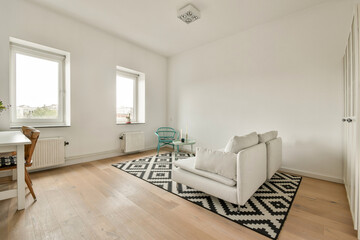 A bright and airy modern living room featuring minimalist design, natural light, and a stylish combination of furniture and decor.