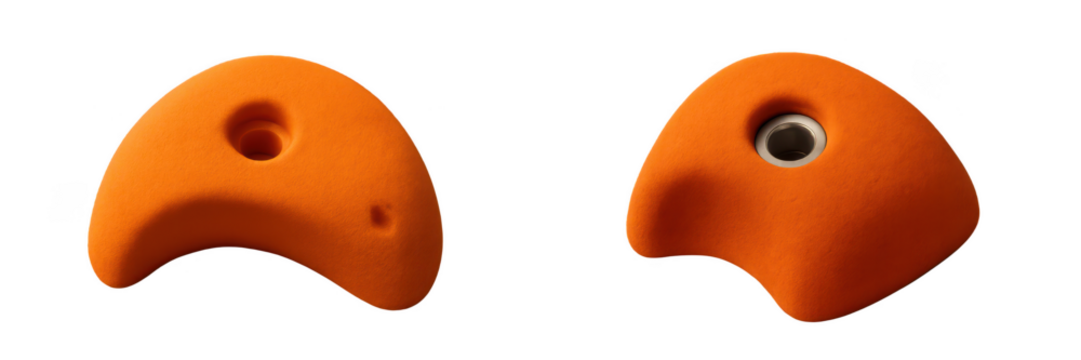 Climbing Holds: A close-up shot showcases two orange climbing holds, emphasizing their textured surfaces. A symbol of challenge and strength.