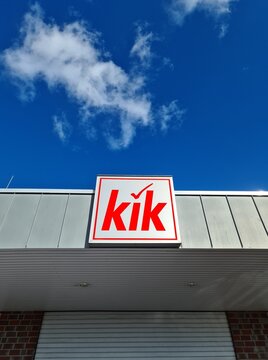 Kiel, Germany - 19. April 2025: KiK logo on a store facade with blue sky and clouds