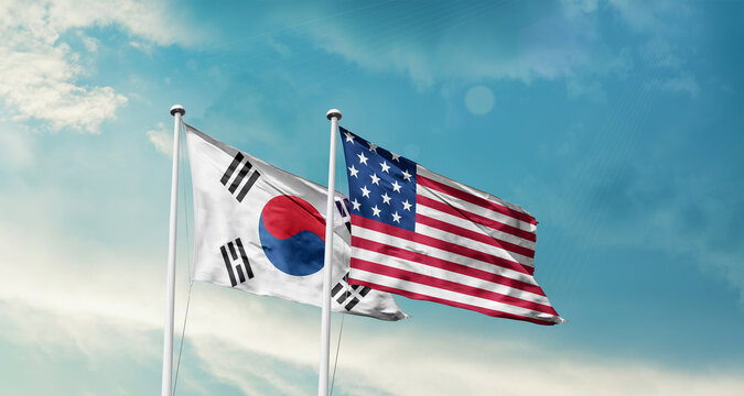 South Korea and America friendship flags are waving in the sky.Two country flag for agreement or deal. Korean USA national flag for comittment. - Powered by Adobe