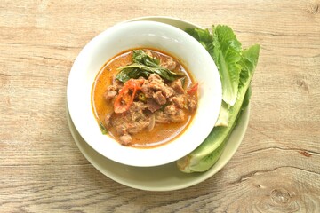spicy boiled beef meat with eggplant in coconut milk red curry soup on bowl eat couple fresh cos vegetable