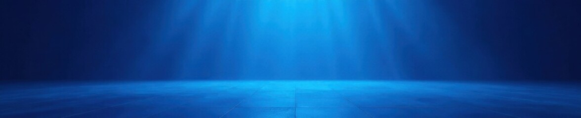 Vast empty stage, blue wash illuminates polished floor, spotlight, stage