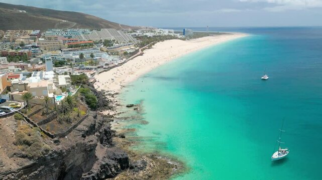 White sandy beach and blue water in Morro Jable, south of Fuerteventura, Canary islands