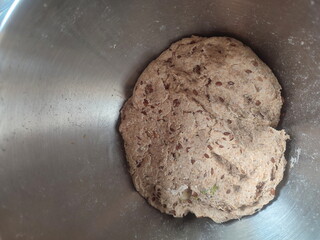 freshly mixed sourdough dough with starter ready for fermentation in a metal bowl