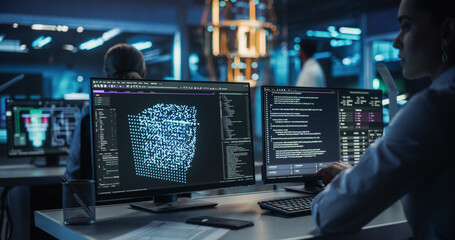 Female Developer Using a Desktop Computer in a Scientific Office, Overseeing Quantum Computing Operations. Diverse Engineer Working on Processor Hardware and Using a Tablet