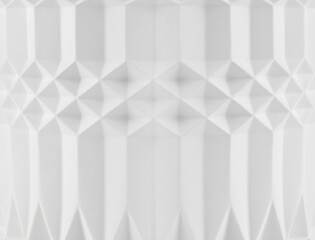 White abstract geometric pattern background. Architectural element of a wall or column in close-up.