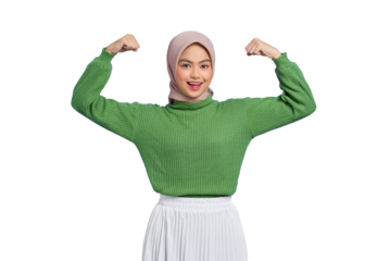 Beautiful smiling Asian woman in green sweater raises arms and shows biceps, demonstrated her achievement after training in a gym isolated on transparent background