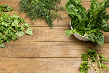 Spinach and olive oil in white bowls.