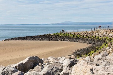 beach in the morning with rock and pier in Morecambe - Lancashire - Lancaster - United Kingdom