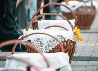 people with food basket waiting for easter blessing