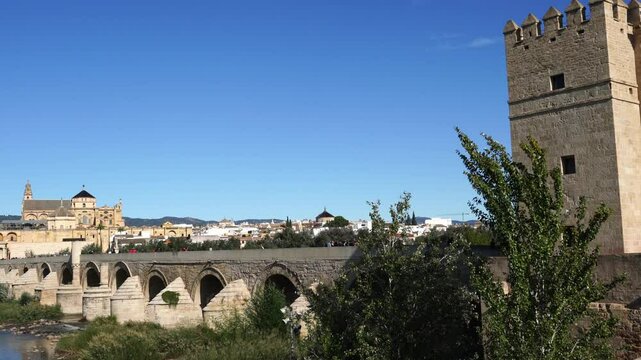 Cordoba, Spain - October 28, 2024: Calahorra tower and Roman bridge with tourists, 