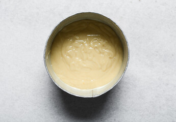 Overhead view of vanilla cake batter,  process of making vanilla cake