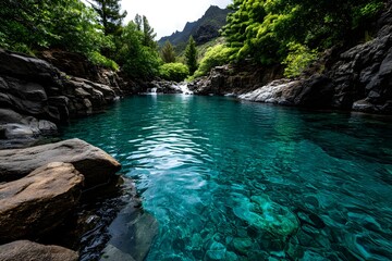 Serene turquoise pool nestled amidst volcanic rock formations.