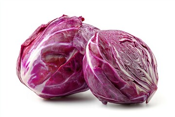 Obraz premium Two red cabbages, one whole and one cut in half isolated on white background