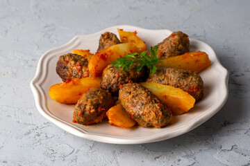 Traditional Homemade Turkish Food Kofte - Kofta with Tomato Sauce and Potatoes. (Turkish name;...