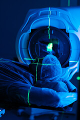 A man undergoing radiation therapy for cancer. Cancer treatment in a modern medical private clinic...