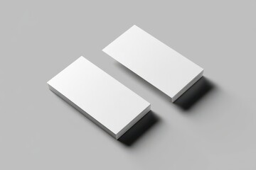 Blank Business Cards Mockup: Two clean, crisp blank business cards arranged side-by-side against a neutral grey background, perfect for showcasing your branding.
