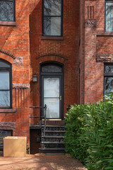 Townhouses in central Washington DC. Entryway, porch on a red brick home.