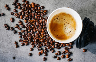 Coffee crema espresso in paper Coffee cup and bean on gray background, Top view of Espresso in  Takeaway paper coffee cup.