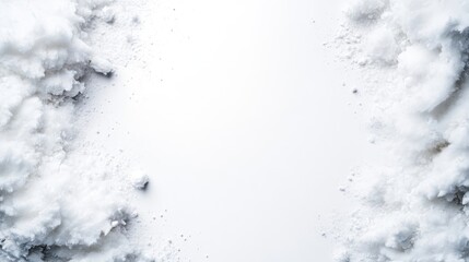 Obraz premium A high angle shot of snow drifts against a white background, creating a textured border.