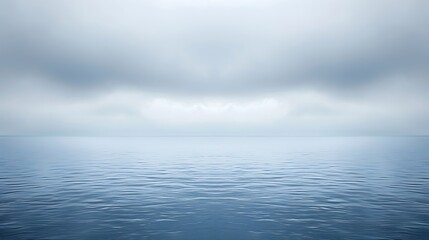 Obraz premium Tranquil ocean view under a cloudy sky creating a sense of calm serenity