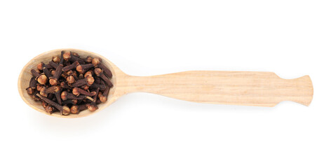 Aromatic cloves in wooden spoon isolated on white, top view