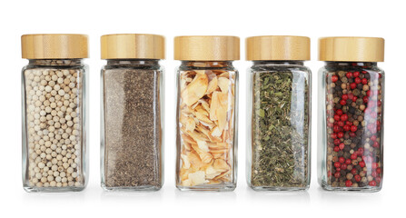 Many different aromatic spices in jars isolated on white