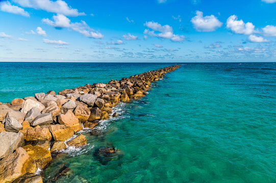 A view along the sea defense from South Pointe Park Pier in Miami in springtime