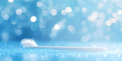 White Toothbrush on Blue Bokeh Background

