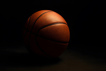 Obraz premium Basketball closeup shot for sports enthusiasts and athletic equipment product promotion on dark background