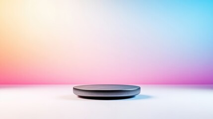 Empty, circular, display podium against a vibrant, multicolored background