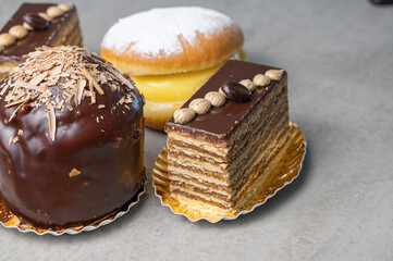 Indulge in our Delicious Pastries A Beautiful Display of Cakes and Doughnuts Await You