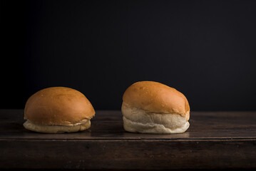 Two Plain Burger Buns on Rustic Wooden Table with Dark Background, Food Mock-Up, Studio Lighting